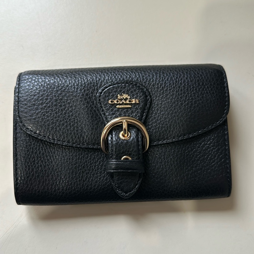 Small leather coach wallet.